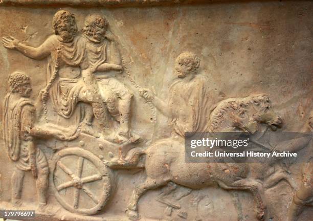 Terracotta panel showing part of a triumphal procession. Roman, made in Italy.