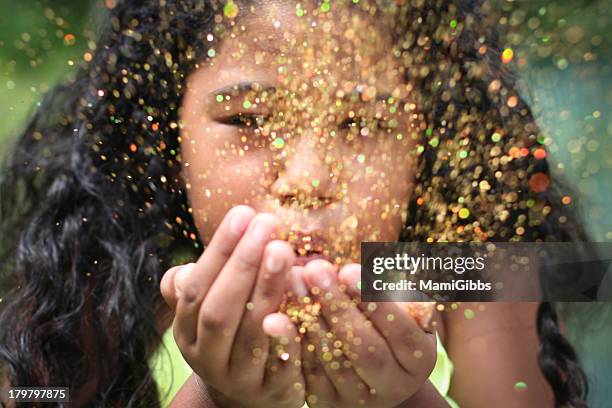 girl  blowing up glitter - sparkle children stock pictures, royalty-free photos & images