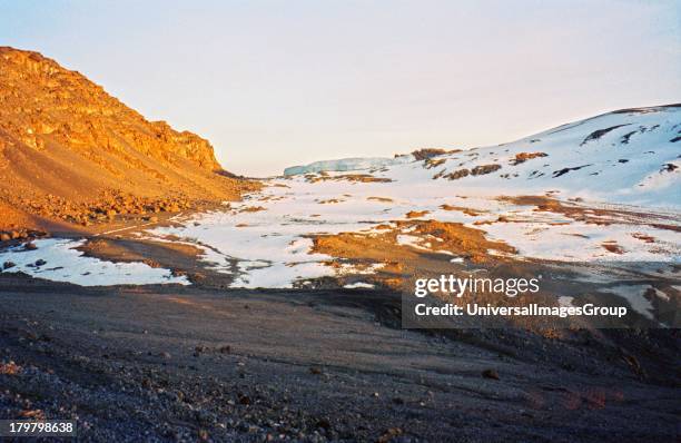 Africa, Tanzania, Mount Kilimanjaro, from inside the summit crater showing the glacier and snow at 19,340 feet.