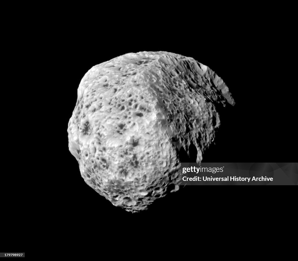 The sponge-like surface of Saturn's moon Hyperion is highlighted in this Cassini portrait.