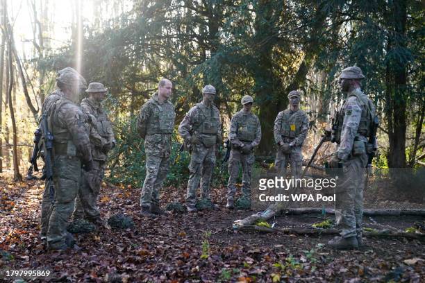 Prince William, The Prince of Wales, Colonel-in-Chief, 1st Battalion Mercian Regiment is shown a ground map of the training assault during a visit to...