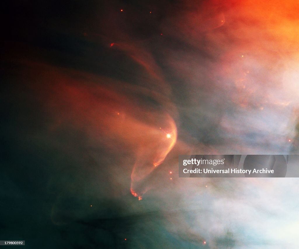 Named for the crescent-shaped wave a ship makes as it moves through water, a bow shock can form in space when two gas streams collide. In this case, the young star, LL Ori, emits a vigorous wind, a stream of charged particles moving rapidly outward f