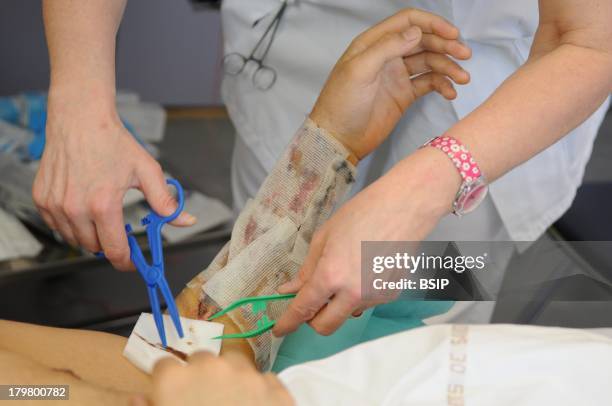 Henry Gabrielle hospital, Lyon, France. Department of urology. Postoperative nursing care of trans male patient after a sex reassignment surgery,...