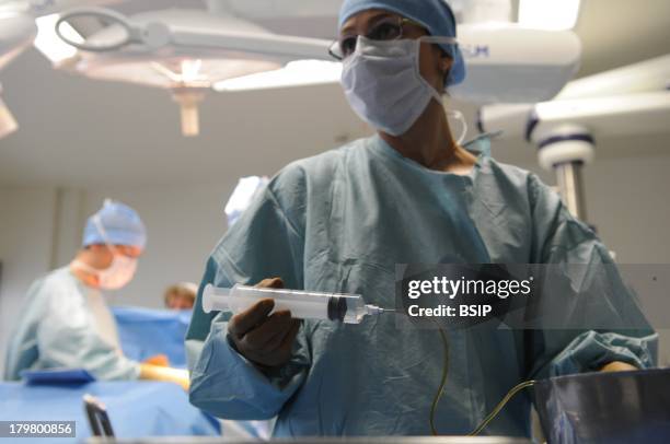 Operating Room Nurse, Lyon Hospital, Department of urology. Surgical treatment of erectile dysfunction with a penile prosthesis. Preparation of the...