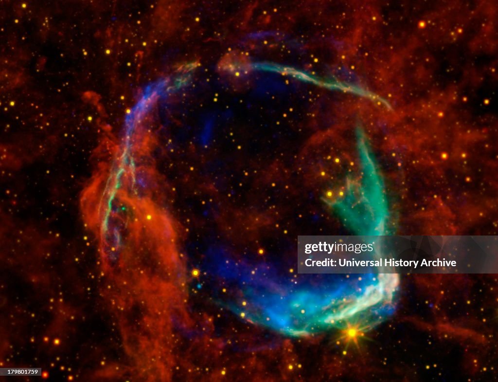 Infrared images from NASA's Spitzer Space Telescope, WISE and Chandra are combined in this image of RCW 86, the dusty remains of the oldest documented example of an exploding star, or supernova.