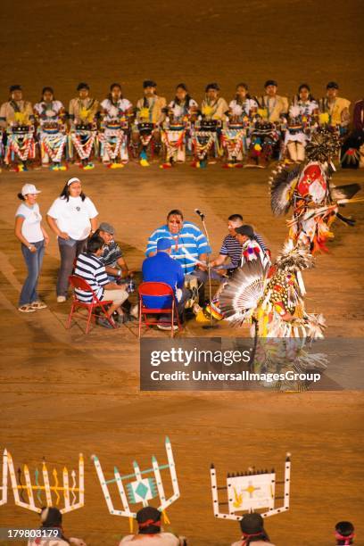 Comanche Indian drum group and dancers, Gallup Inter-Tribal Indian Ceremonial, Gallup, New Mexico.