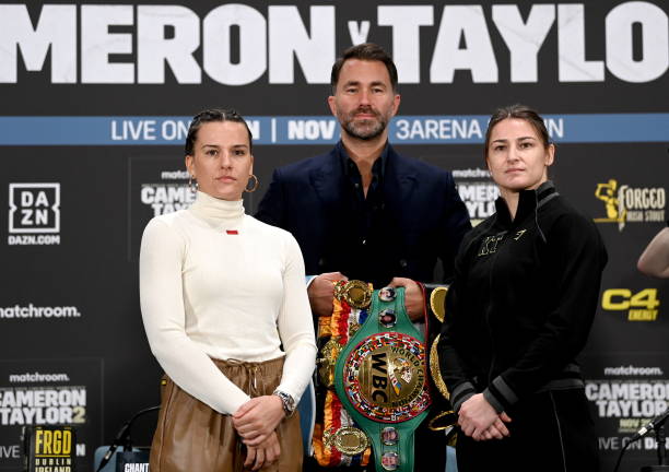 Dublin , Ireland - 23 November 2023; Chantelle Cameron and Katie Taylor square-off, in the company of promoter Eddie Hearn, during a press conference...