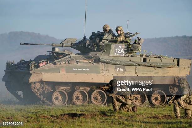 Prince William, The Prince of Wales, Colonel-in-Chief, 1st Battalion Mercian Regiment , rides in an armoured vehicle while on a training exercise...