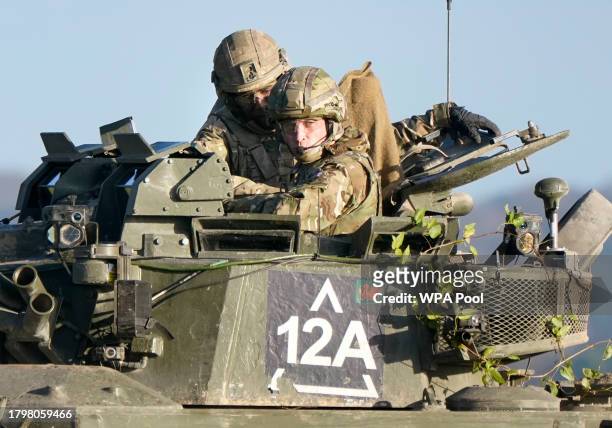 Prince William, The Prince of Wales, Colonel-in-Chief, 1st Battalion Mercian Regiment , rides in an armoured vehicle while on a training exercise...