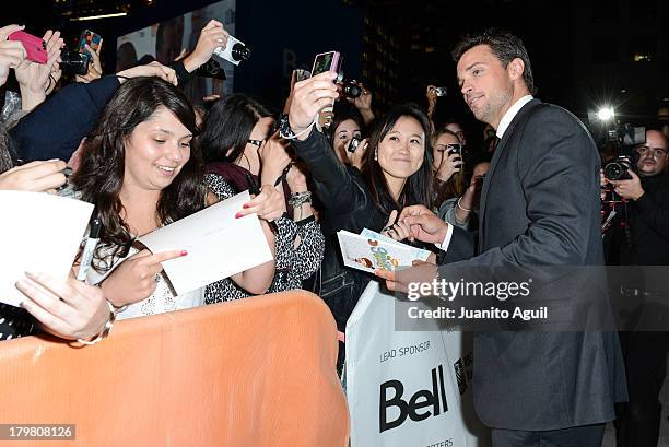Tom Welling with fans at the premiere of Parkland at Roy Thomson Hall on September 6, 2013 in Toronto, Canada.