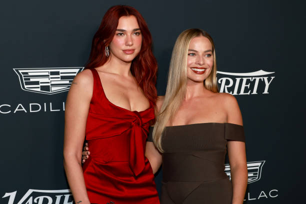 Dua Lipa and Margot Robbie attend the 2023 Variety Power Of Women at Mother Wolf on November 16, 2023 in Los Angeles, California.