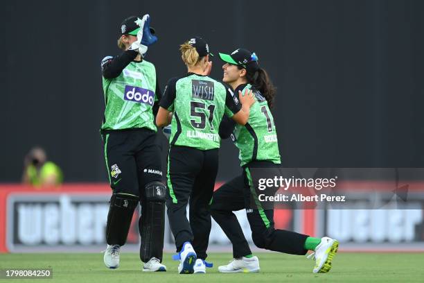 Maia Bouchier of the Stars is congratulated by team mates after catching out Elyse Villani of the Hurricanes during the WBBL match between Melbourne...