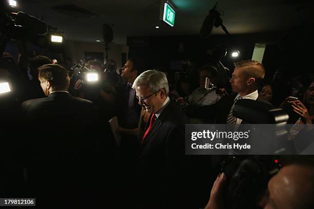 Australian Labor Party Leader, Kevin Rudd leaves the stage after he concedes defeat in the 2013 Australian election, at The Gabba on September 7,...