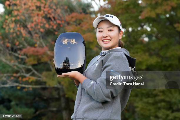 Yumeka Kobayashi of Japan poses with the trophy after winning the tournament following the final round of Kyoto Ladies Open at Joyo Country Club on...