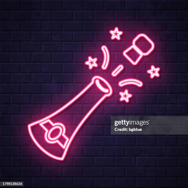 champagne explosion. glowing neon icon on brick wall background - champagne cork stock illustrations