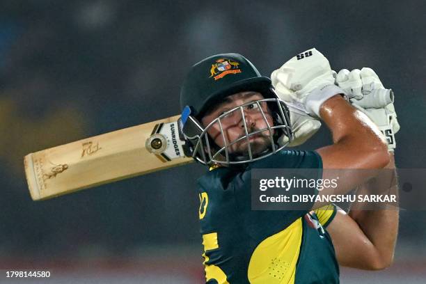 Australia's Tim David plays a shot during the first Twenty20 international cricket match between India and Australia at the Y.S. Rajasekhara Reddy...