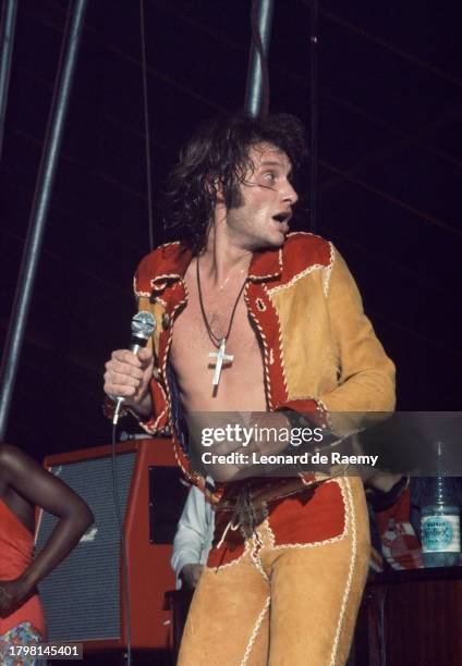 French singer Johnny Hallyday on stage for his new show "Johnny Circus", Summer 1972.