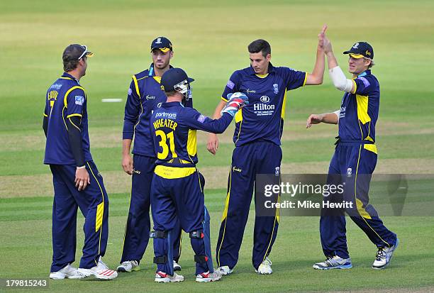 Hris Wood of Hampshire celebrates with team mates after dismissing Gareth Rees of Glamorgan caught by wicketkeeper Adam Wheater during the Yorkshire...