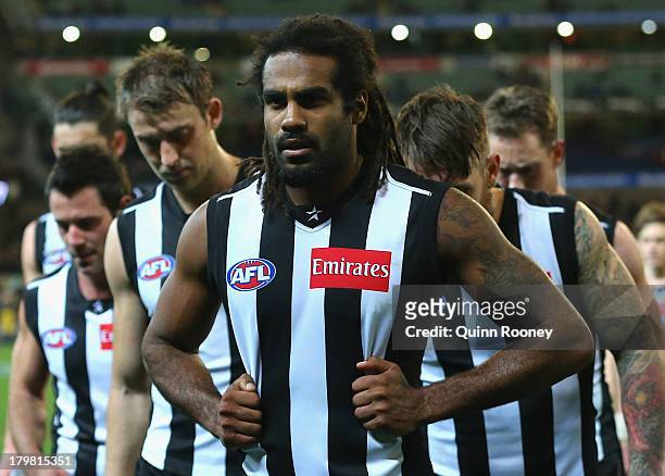 Heritier O'Brien of the Magpies looks dejected after losing the Second AFL Elimination Final match between the Collingwood Magpies and the Port...