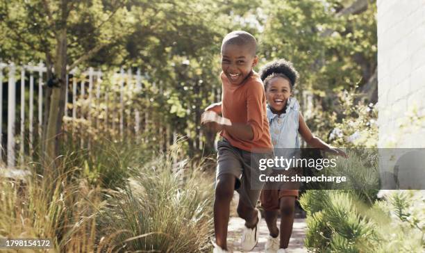 happy, black kids running in garden and play game together outdoor at home. african children in backyard, excited and race or funny sister chase brother, bonding and laughing for freedom or energy - tag 2 stock pictures, royalty-free photos & images