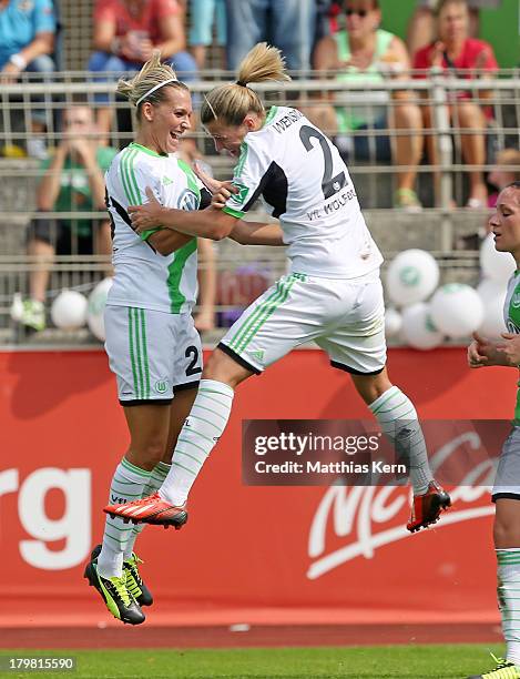 Lena Goessling of Wolfsburg jubilates with team mate Luisa Wensing after scoring the second goal during the Women's Bundesliga match between VFL...