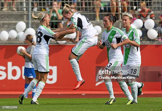 Lena Goessling of Wolfsburg jubilates with team mate Luisa Wensing after scoring the second goal during the Women's Bundesliga match between VFL...