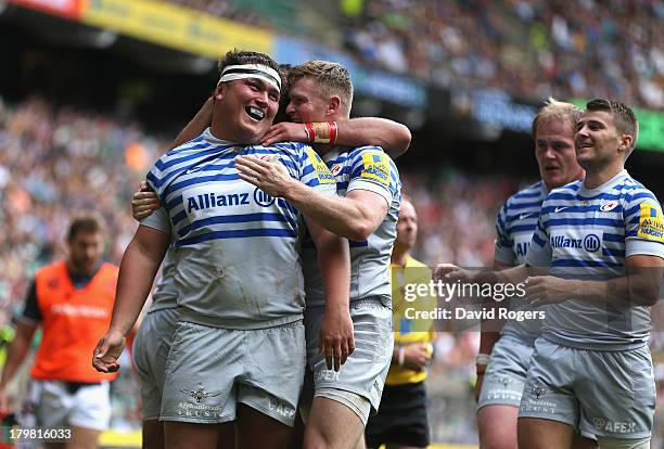 Jamie George of Saracens is mobbed by team mates after scoring his second try during the Aviva Premiership match between London Irish and Saracens at...