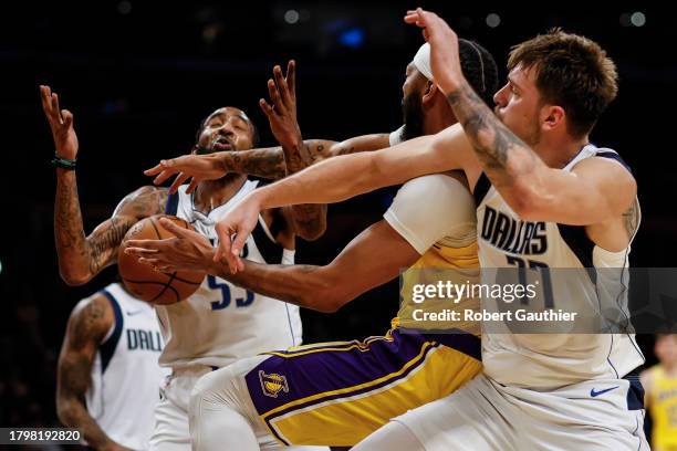 Los Angeles, CA, Wednesday, November 22, 2023 - Los Angeles Lakers forward Anthony Davis battles with Dallas Mavericks forward Derrick Jones Jr. And...