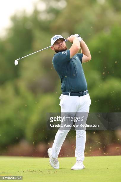 Tyrrell Hatton of England plays his second shot on the third hole during Day Two of the DP World Tour Championship on the Earth Course at Jumeirah...
