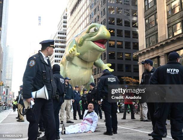 New York Police Department members intervene and take two pro-Palestinian protesters into custody, who entered the parade, during the traditional...