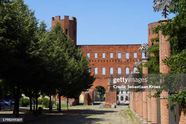 porta palatina, city gate, with trees, torino, italy - porta palatina stock pictures, royalty-free photos & images