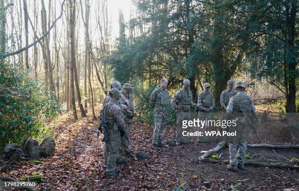 Prince William, Prince of Wales, Colonel-in-Chief, 1st Battalion Mercian Regiment listens to a briefing ahead of an attack exercise during a visit to...