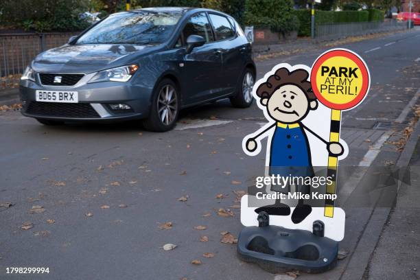 Illustrated characters of small children war motorists not to park at a nearby primary school in Kings Heath on 7th November 2023 in Birmingham,...