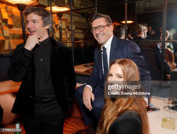 Nathan Fielder, Jon Hamm, and Anna Osceola attend the GQ Men of the Year Party 2023 at Bar Marmont on November 16, 2023 in Los Angeles, California.