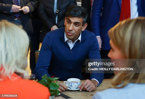 Britain's Prime Minister Rishi Sunak talks during a meeting with small business owners from Sunny Bank Mills, during a visit to The Emma White...