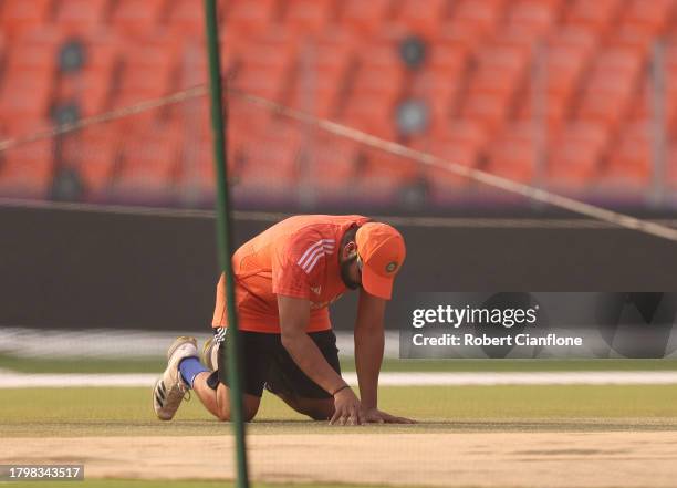 Rohit Sharma of India inspects the pitch during a India training session during the ICC Men's Cricket World Cup India 2023 at Narendra Modi Stadium...