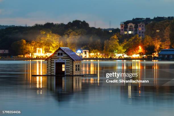 floating wooden hut on a lake, valea morilor park (parcul valea morilor) at night, chisinau, moldova - moldova city stock pictures, royalty-free photos & images