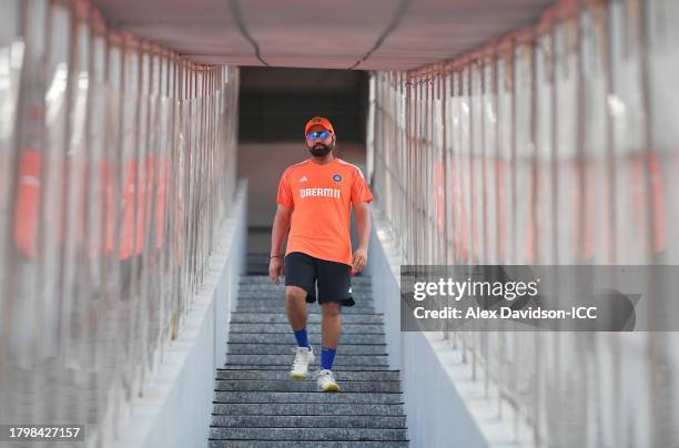 India captain Rohit Sharma walks down from the changing room during a India Nets Session ahead of the ICC Men's Cricket World Cup Final between India...