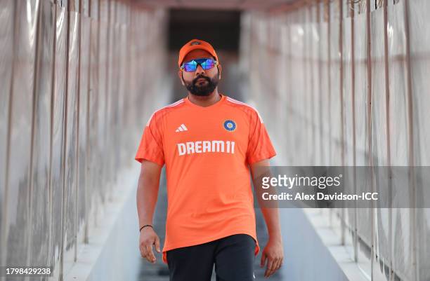 India captain Rohit Sharma walks down from the changing room during a India Nets Session ahead of the ICC Men's Cricket World Cup Final between India...