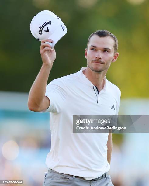 Nicolai Hojgaard of Denmark acknowledges the crowd on the 18th green during Day Two of the DP World Tour Championship on the Earth Course at Jumeirah...