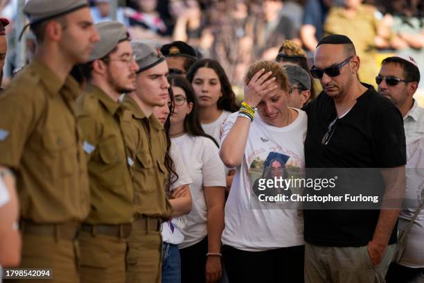 The parents of Israeli soldier Corporal Noa Marciano attend her funeral at Modi'in Military Cemetery Noa Marciano, on November 17, 2023 in...