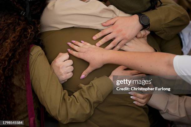 Soldiers react as they attend the funeral of Israeli soldier Corporal Noa Marciano at Modi'in Military Cemetery Noa Marciano, on November 17, 2023 in...