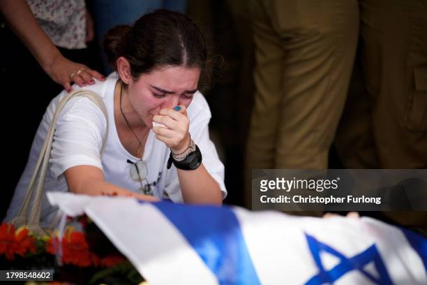 Mourners attend the funeral of Israeli soldier Corporal Noa Marciano at Modi'in Military Cemetery Noa Marciano, on November 17, 2023 in...