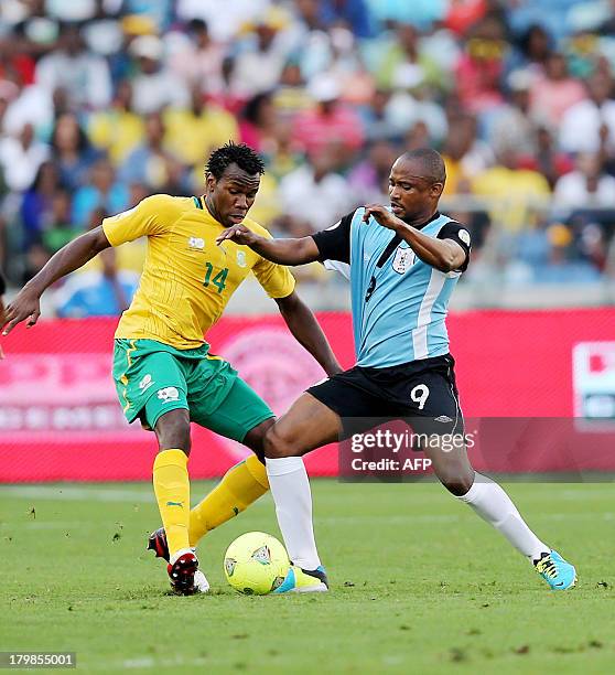 South Africa's Bongani Khumalo vies with Botswana's Jerome Ramatlhwna during a 2014 FIFA World Cup Qualifying football match South Africa vs Botswana...