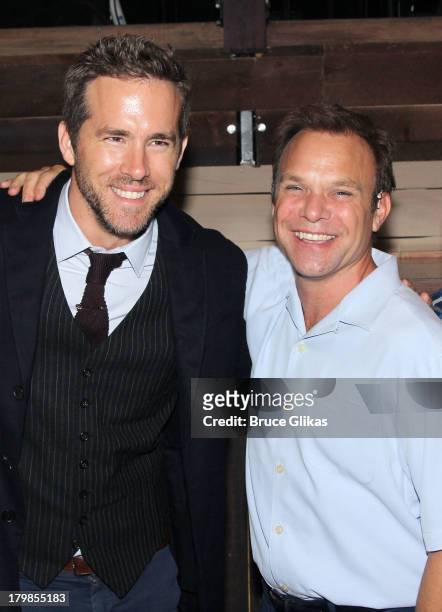 Ryan Reynolds and Norbert Leo Butz pose backstage at the musical "Big Fish" on Broadway at The Neil Simon Theater on September 6, 2013 in New York...