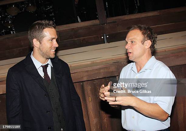 Ryan Reynolds and Norbert Leo Butz backstage at the musical "Big Fish" on Broadway at The Neil Simon Theater on September 6, 2013 in New York City.