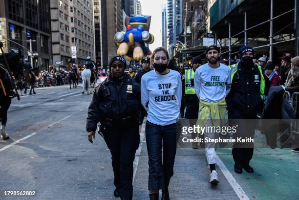 Pro-Palestinian protesters are detained during Macy's annual Thanksgiving Day Parade on November 23, 2023 in New York City. Thousands of people lined...