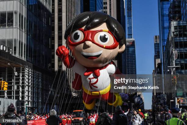 The Red Titan from Ryan's World balloon floats in Macy's annual Thanksgiving Day Parade on November 23, 2023 in New York City. Thousands of people...