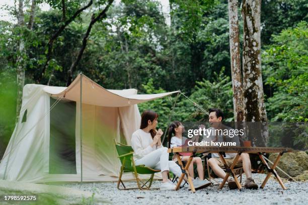 asian family having fun time glamping in the forest - asian family camping stock pictures, royalty-free photos & images