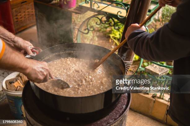 boiling a big pot of something delicious - lard stock pictures, royalty-free photos & images